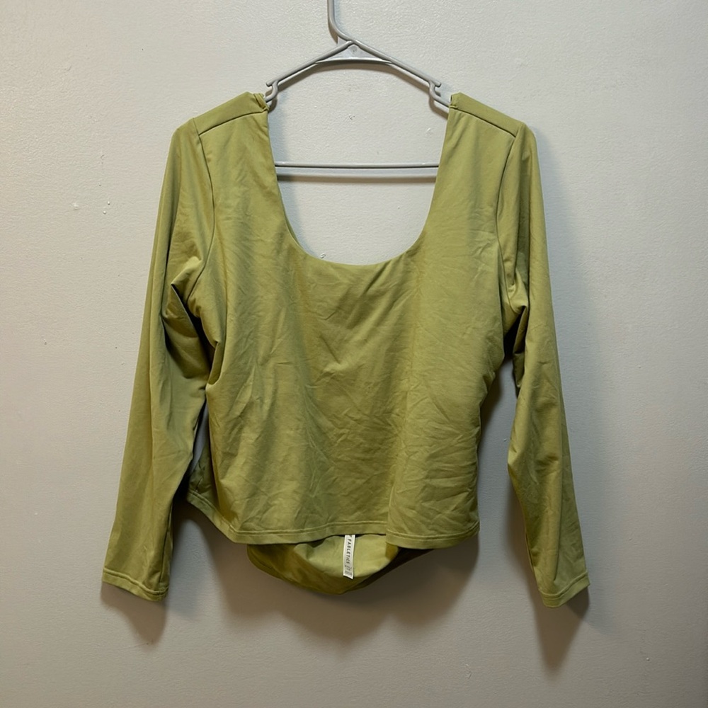 Green Fabletics moisture-wicking top. Built-in bra and open back.